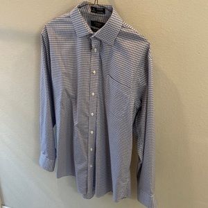 Men’s blue square pattern button down dress shirt.